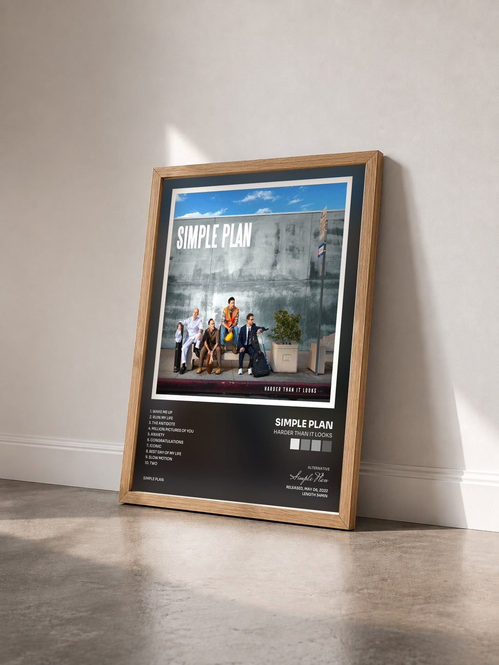 #bois Tableau de l'album Harder Than It Looks de Simple Plan vu de trois quarts, cadre en bois brut