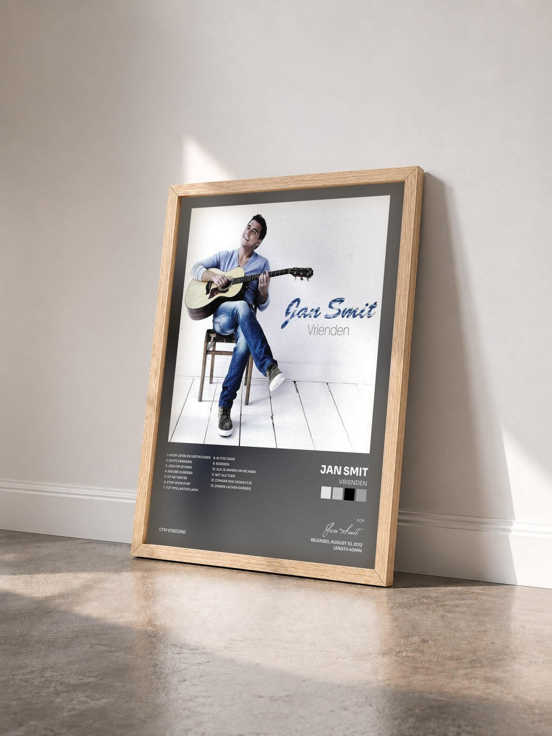 #bois Tableau de l'album Vrienden de Jan Smit vu de trois quarts, cadre en bois brut