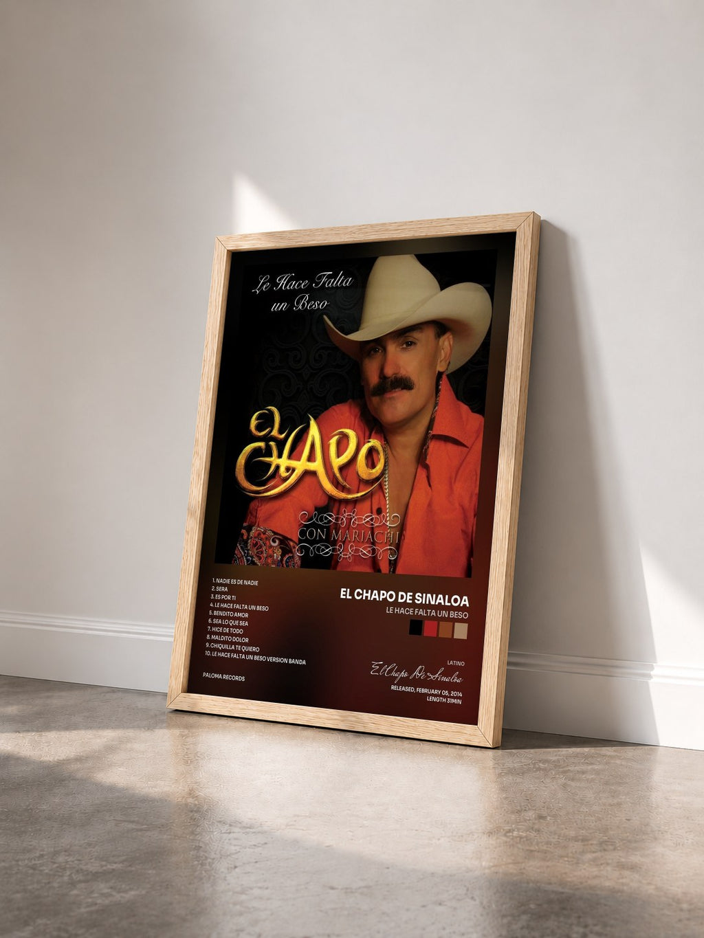 #bois Tableau de l'album Le Hace Falta Un Beso de El Chapo De Sinaloa vu de trois quarts, cadre en bois brut