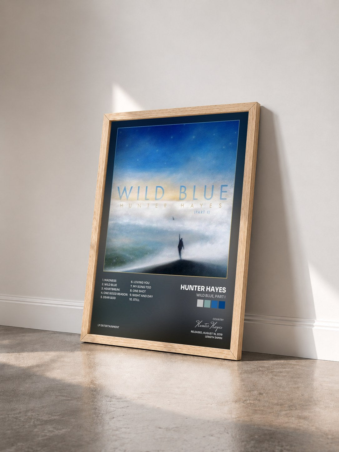 #bois Tableau de l'album Wild Blue, Part I de Hunter Hayes vu de trois quarts, cadre en bois brut