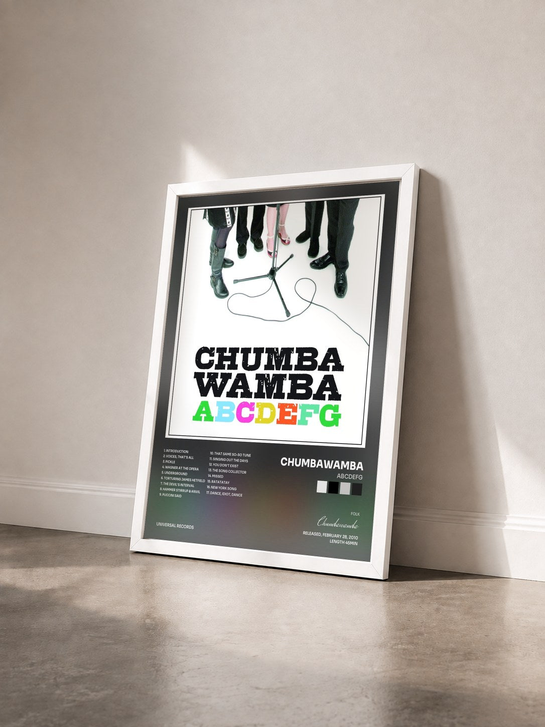 #blanc Tableau de l'album ABCDEFG de Chumbawamba vu de trois quarts, cadre blanc