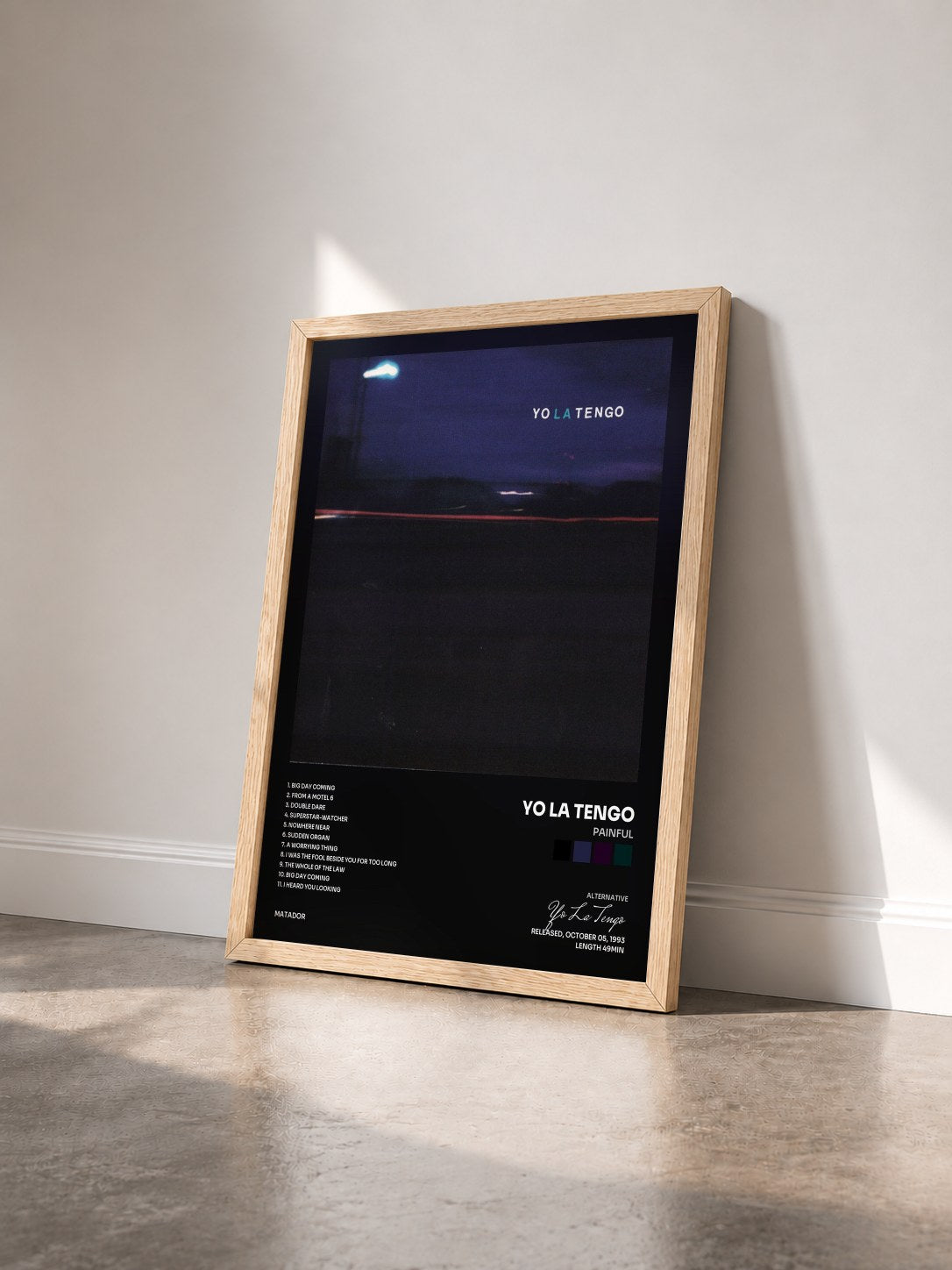 #bois Tableau de l'album Painful de Yo La Tengo vu de trois quarts, cadre en bois brut