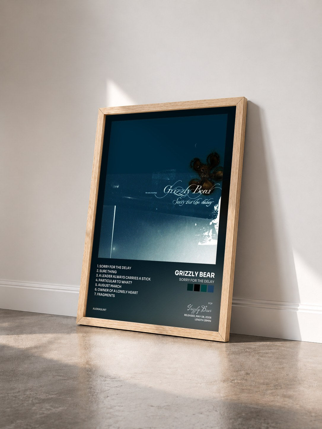 #bois Tableau de l'album Sorry for the Delay de Grizzly Bear vu de trois quarts, cadre en bois brut