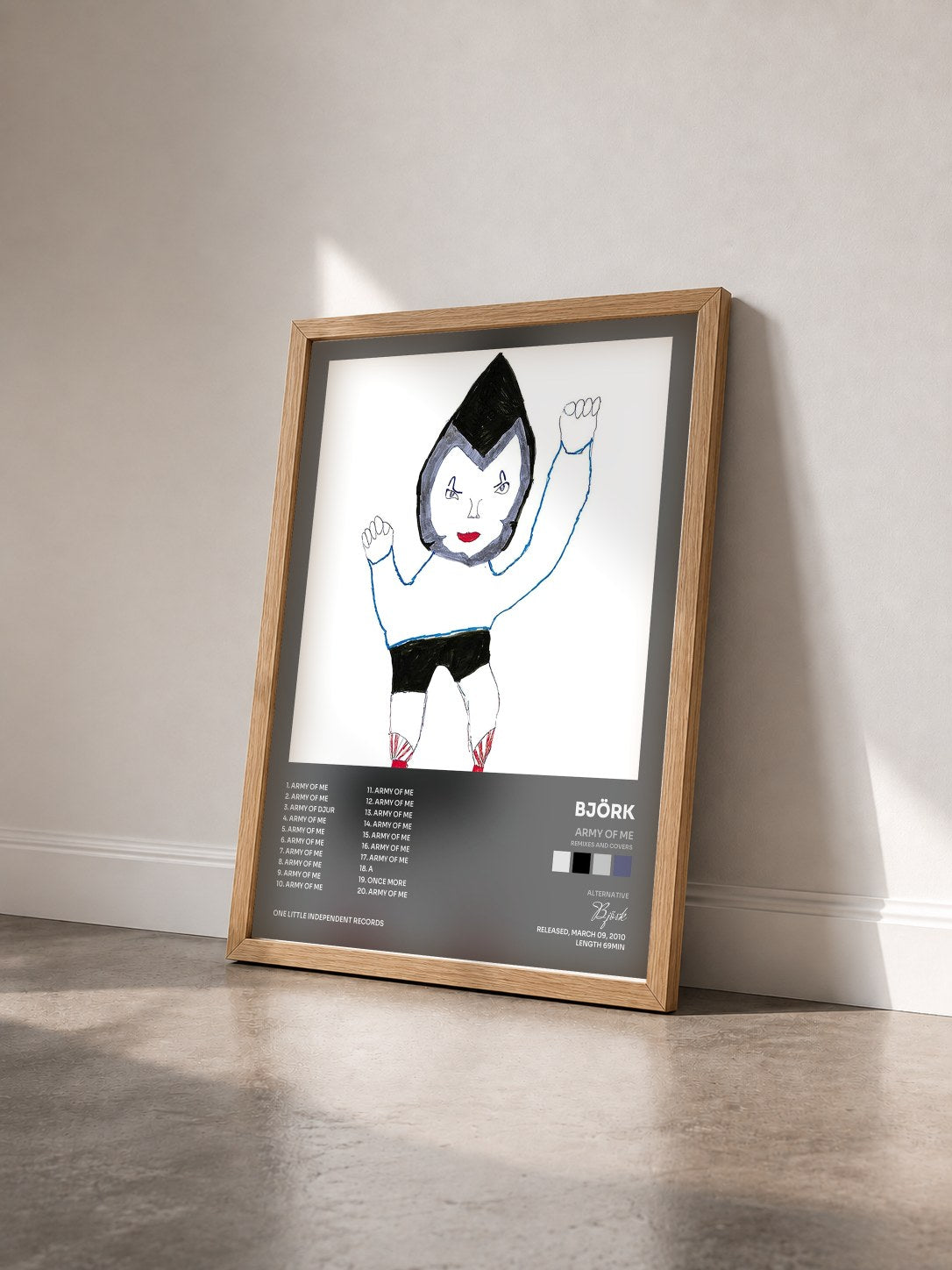 #bois Tableau de l'album Army Of Me (Remixes And Covers) de Björk vu de trois quarts, cadre en bois brut