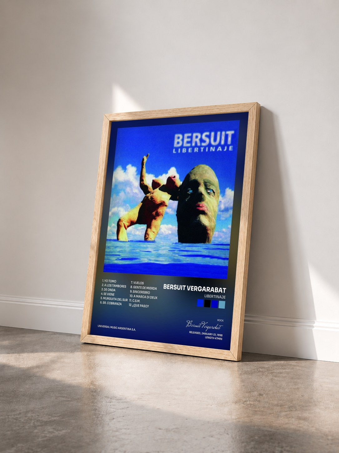 #bois Tableau de l'album Libertinaje de Bersuit Vergarabat vu de trois quarts, cadre en bois brut