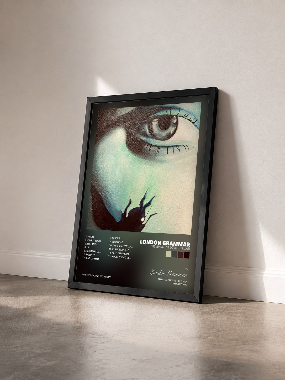 #noir The Greatest Love (Deluxe) by London Grammar as a framed art print seen at an angle, black frame