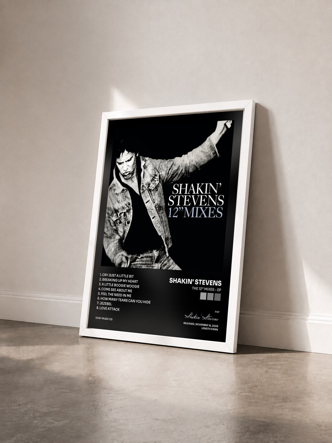 #blanc Tableau de l'album The 12" Mixes - EP de Shakin' Stevens vu de trois quarts, cadre blanc