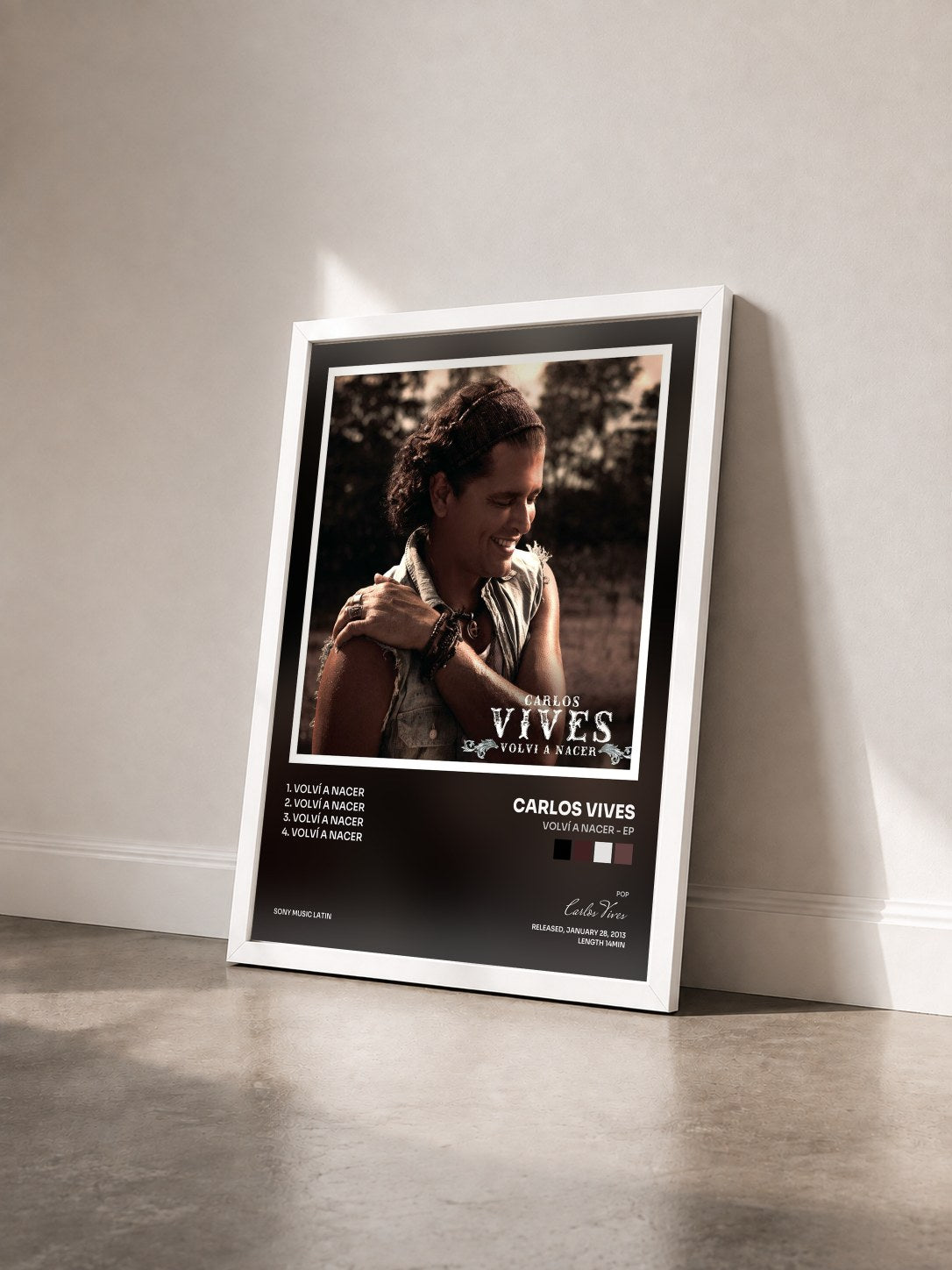 #blanc Tableau de l'album Volví A Nacer - EP de Carlos Vives vu de trois quarts, cadre blanc