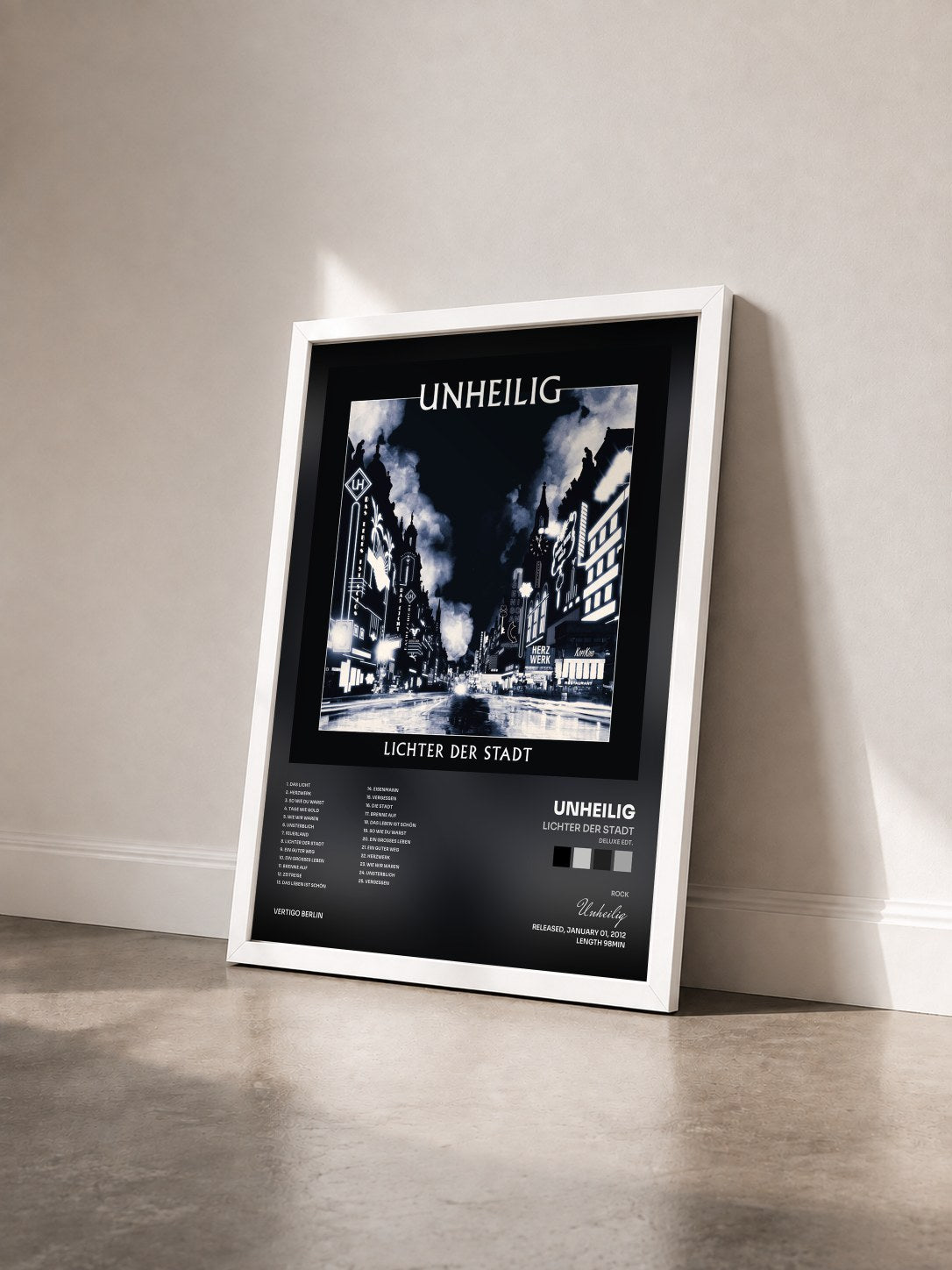 #blanc Tableau de l'album Lichter der Stadt (Deluxe Edt.) de Unheilig vu de trois quarts, cadre blanc