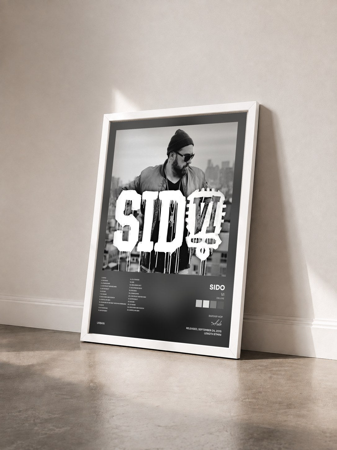 #blanc Tableau de l'album VI (Deluxe) de Sido vu de trois quarts, cadre blanc