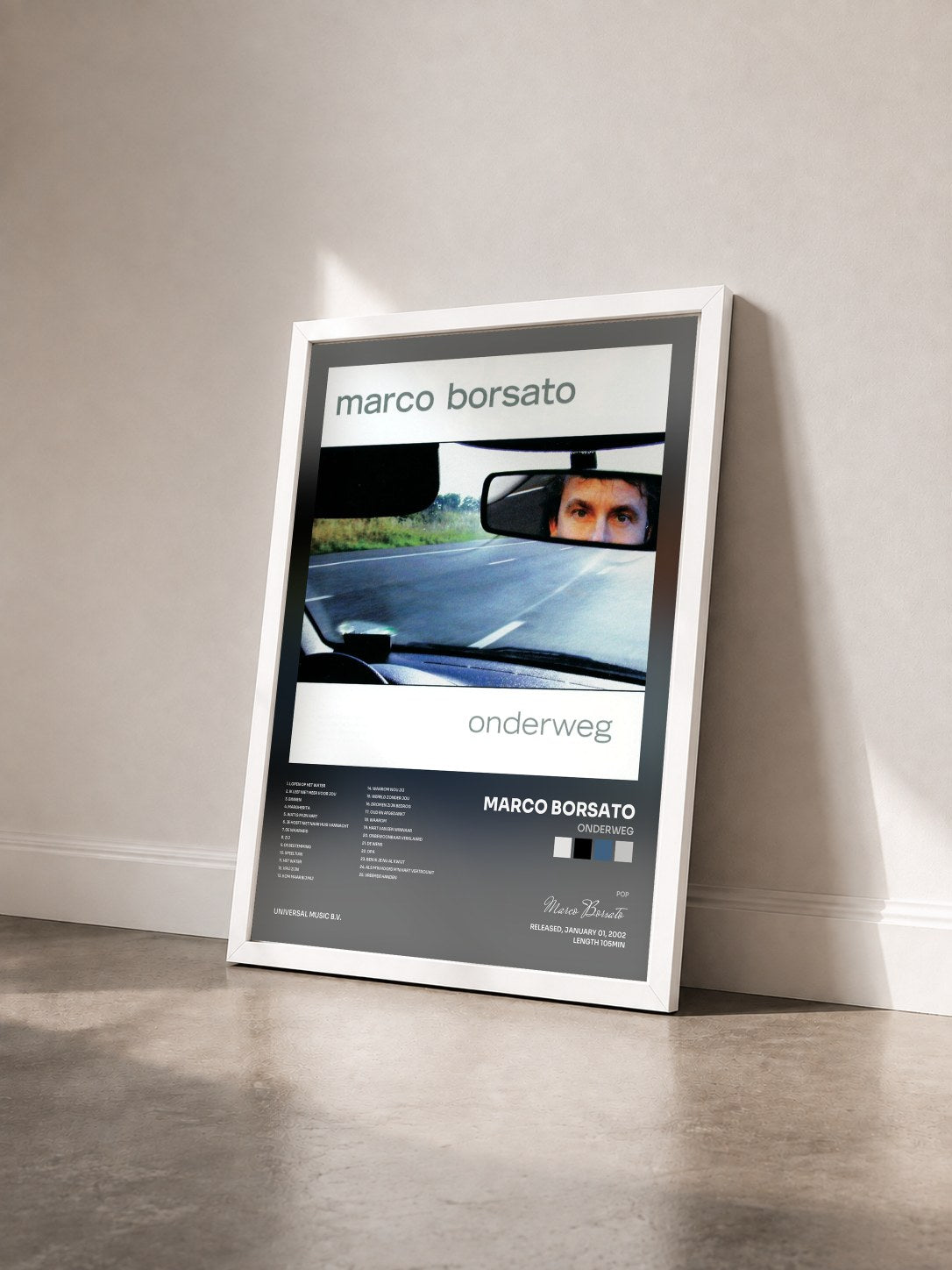 #blanc Tableau de l'album Onderweg de Marco Borsato vu de trois quarts, cadre blanc