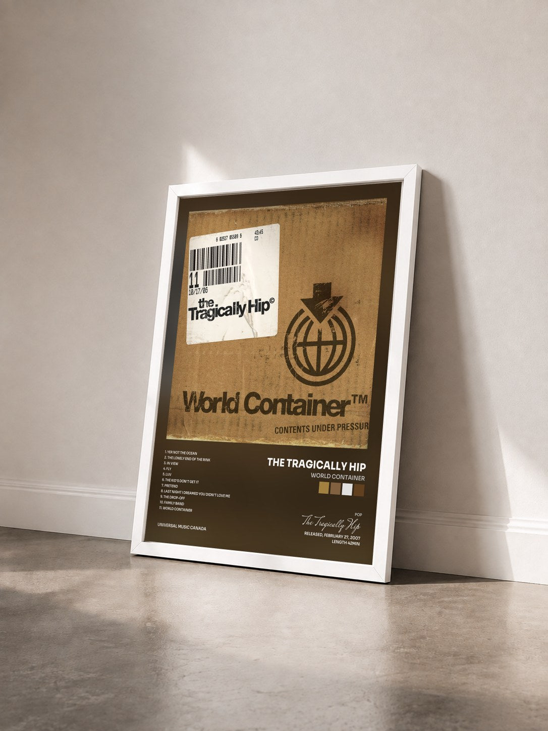 #blanc Tableau de l'album World Container de The Tragically Hip vu de trois quarts, cadre blanc