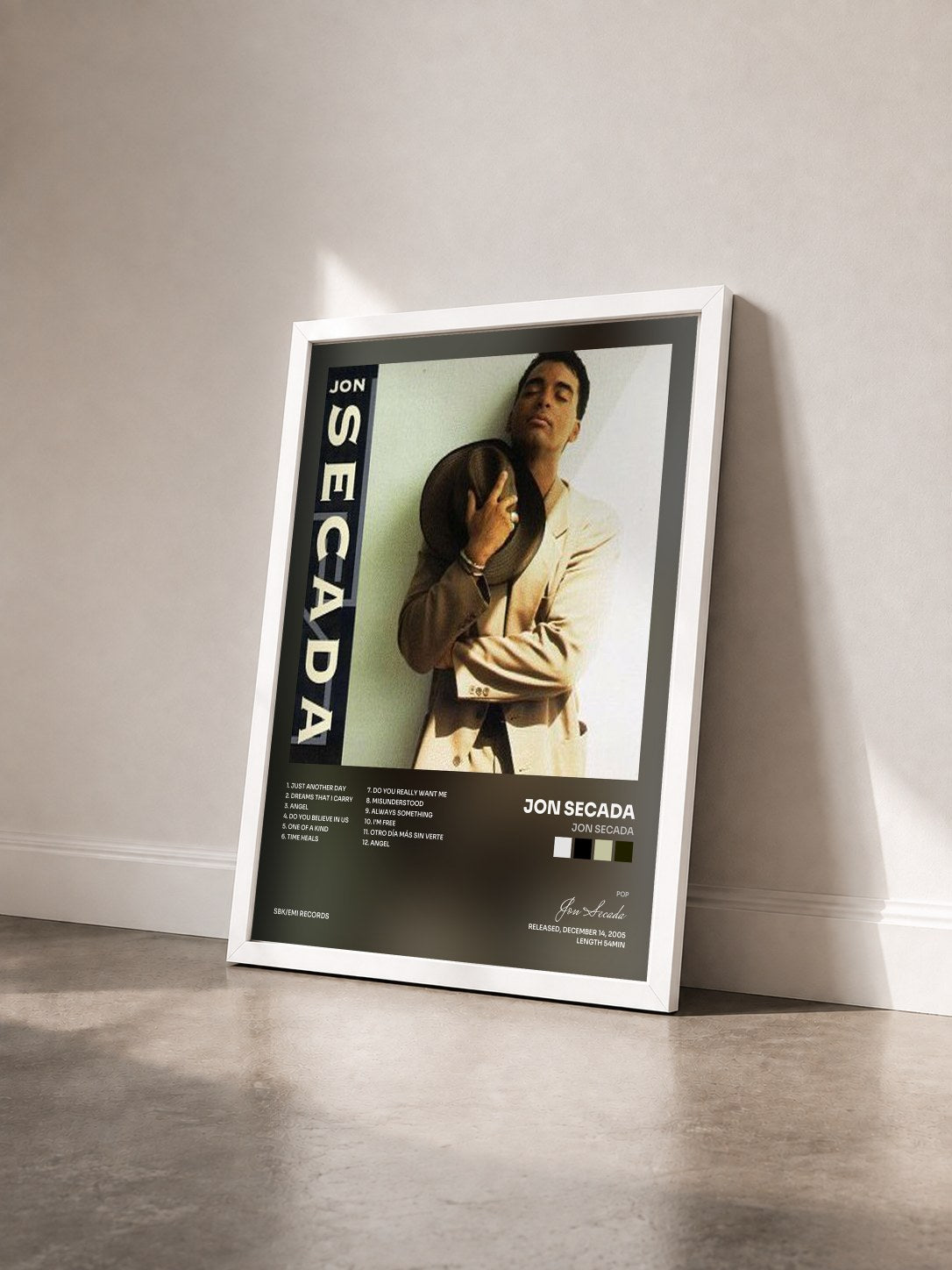 #blanc Tableau de l'album Jon Secada de Jon Secada vu de trois quarts, cadre blanc