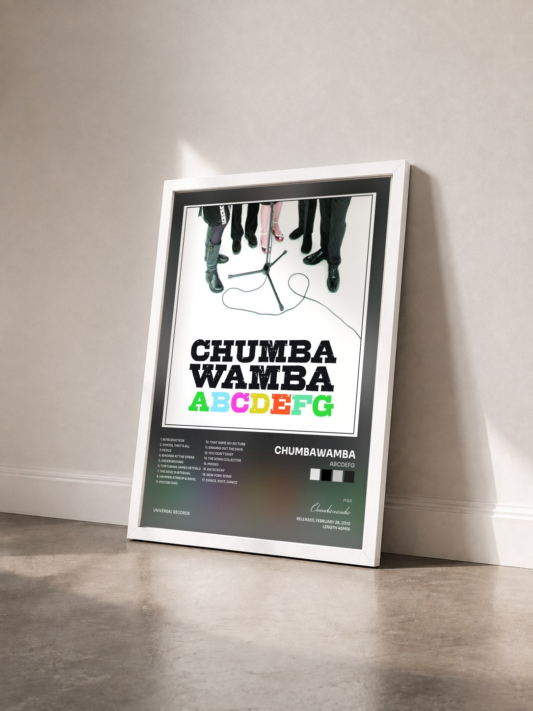 #blanc Tableau de l'album ABCDEFG de Chumbawamba vu de trois quarts, cadre blanc