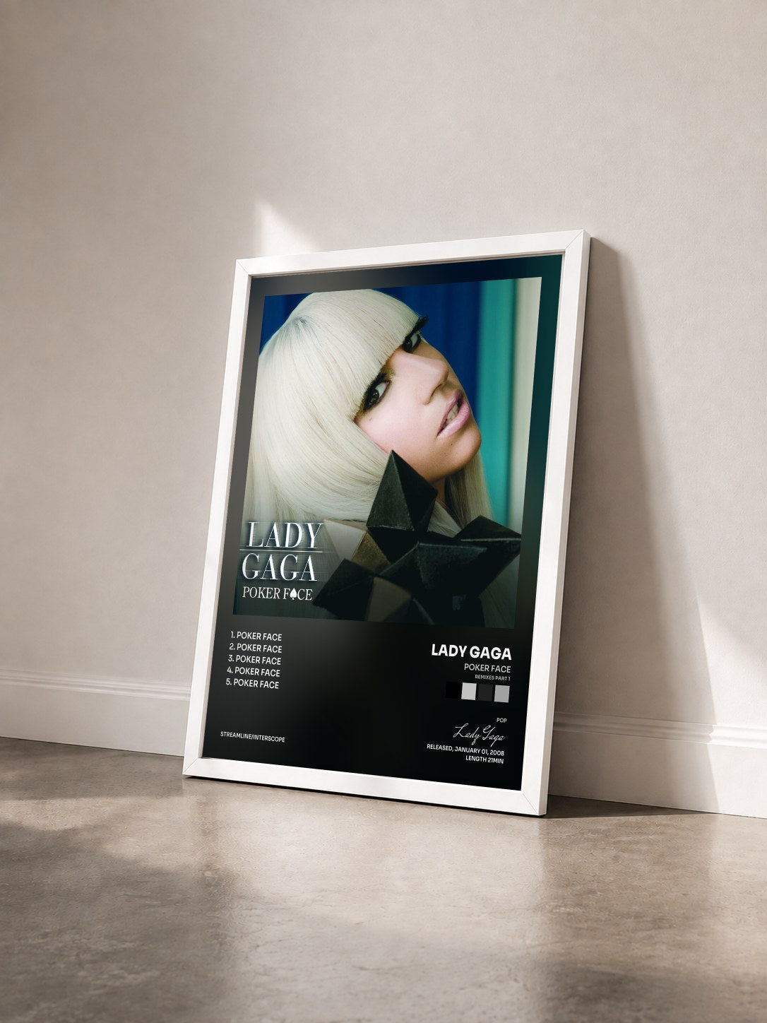 #blanc Tableau de l'album Poker Face (Remixes Part 1) de Lady Gaga vu de trois quarts, cadre blanc