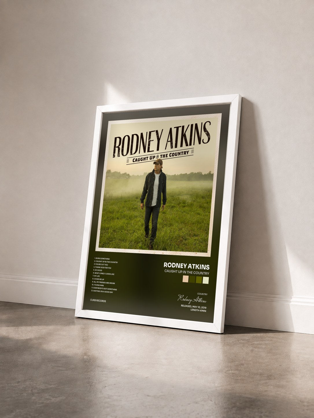 #blanc Tableau de l'album Caught Up In The Country de Rodney Atkins vu de trois quarts, cadre blanc