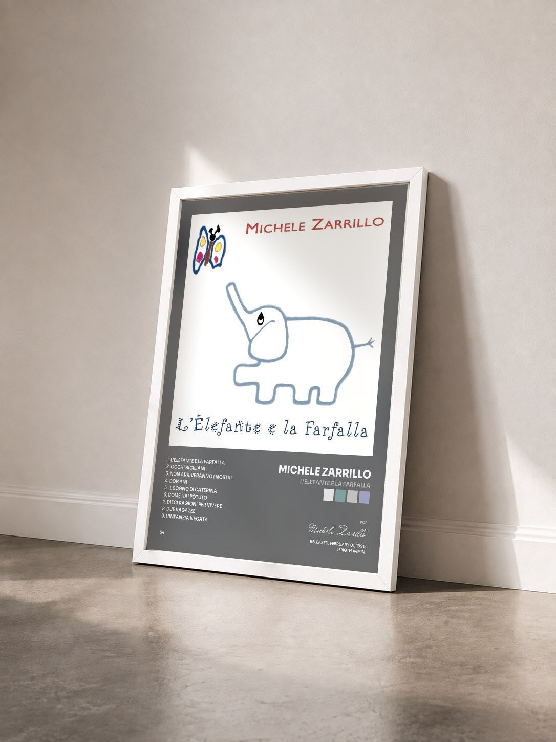 #blanc Tableau de l'album L'Elefante E La Farfalla de Michele Zarrillo vu de trois quarts, cadre blanc