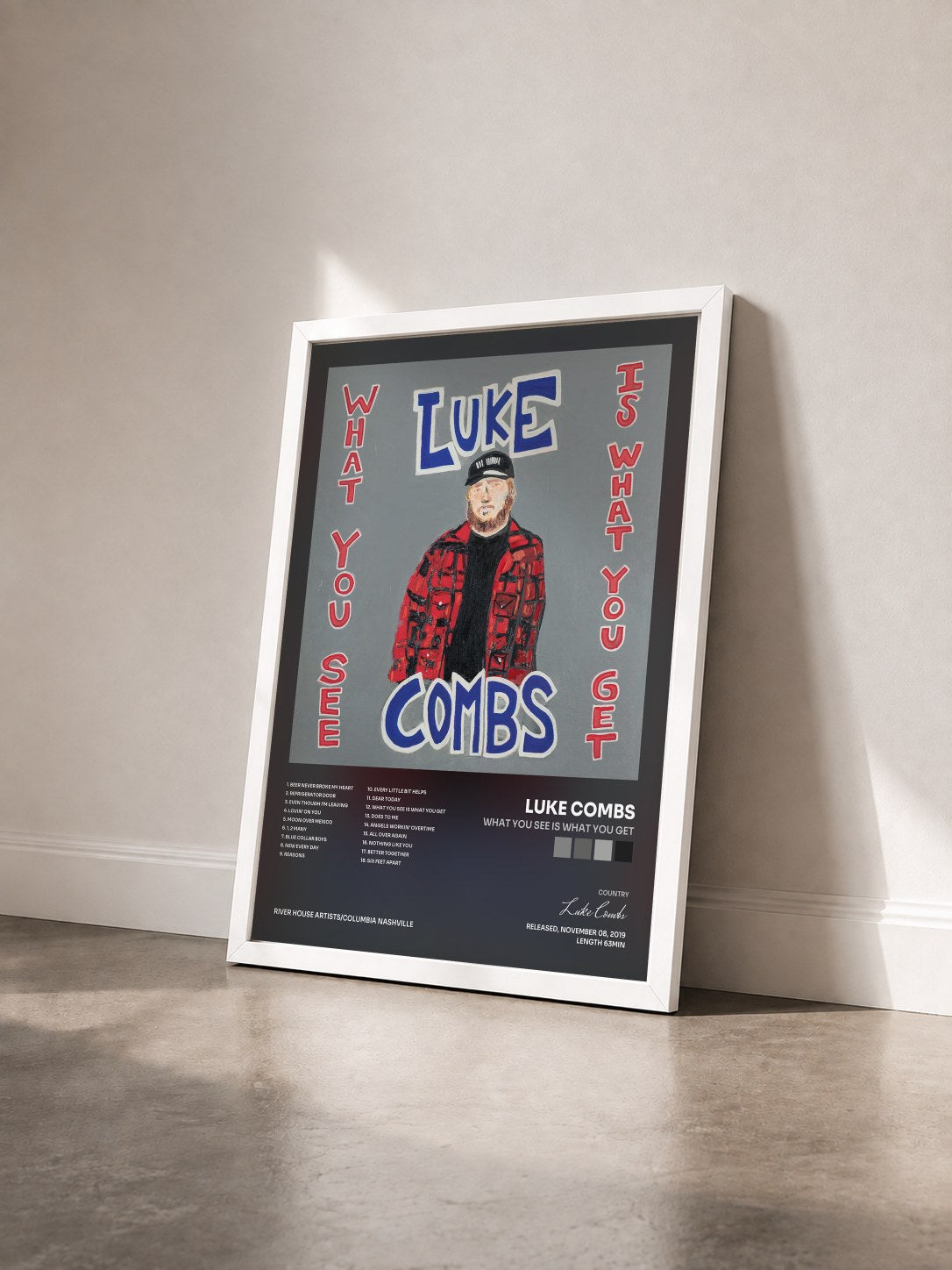 #blanc Tableau de l'album What You See Is What You Get de Luke Combs vu de trois quarts, cadre blanc