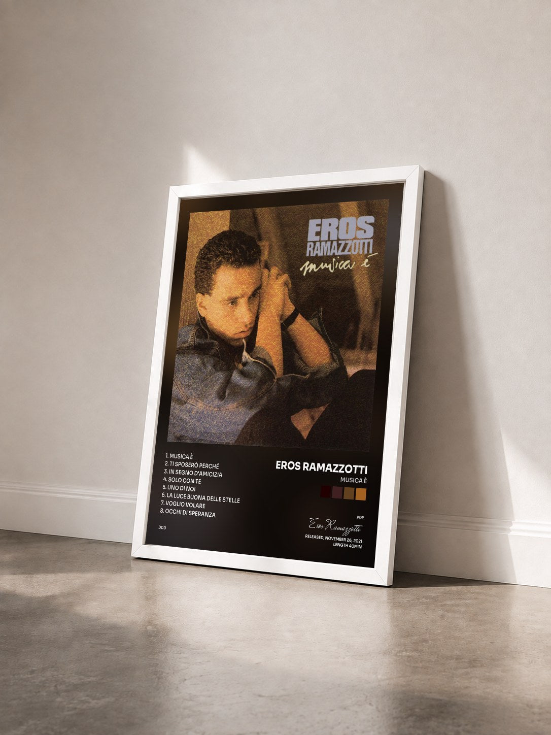 #blanc Tableau de l'album Musica è de Eros Ramazzotti vu de trois quarts, cadre blanc