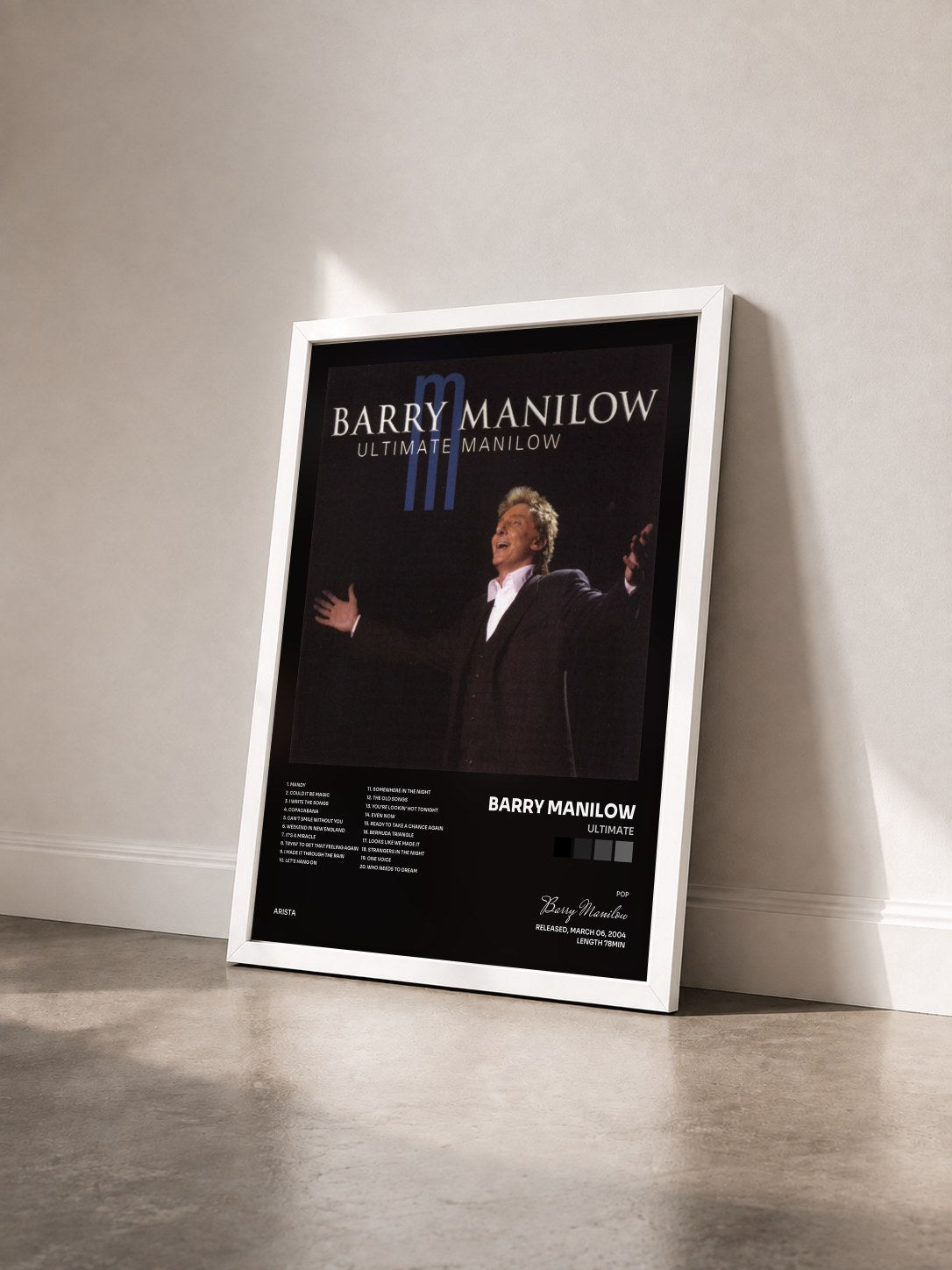 #blanc Tableau de l'album Ultimate de Barry Manilow vu de trois quarts, cadre blanc