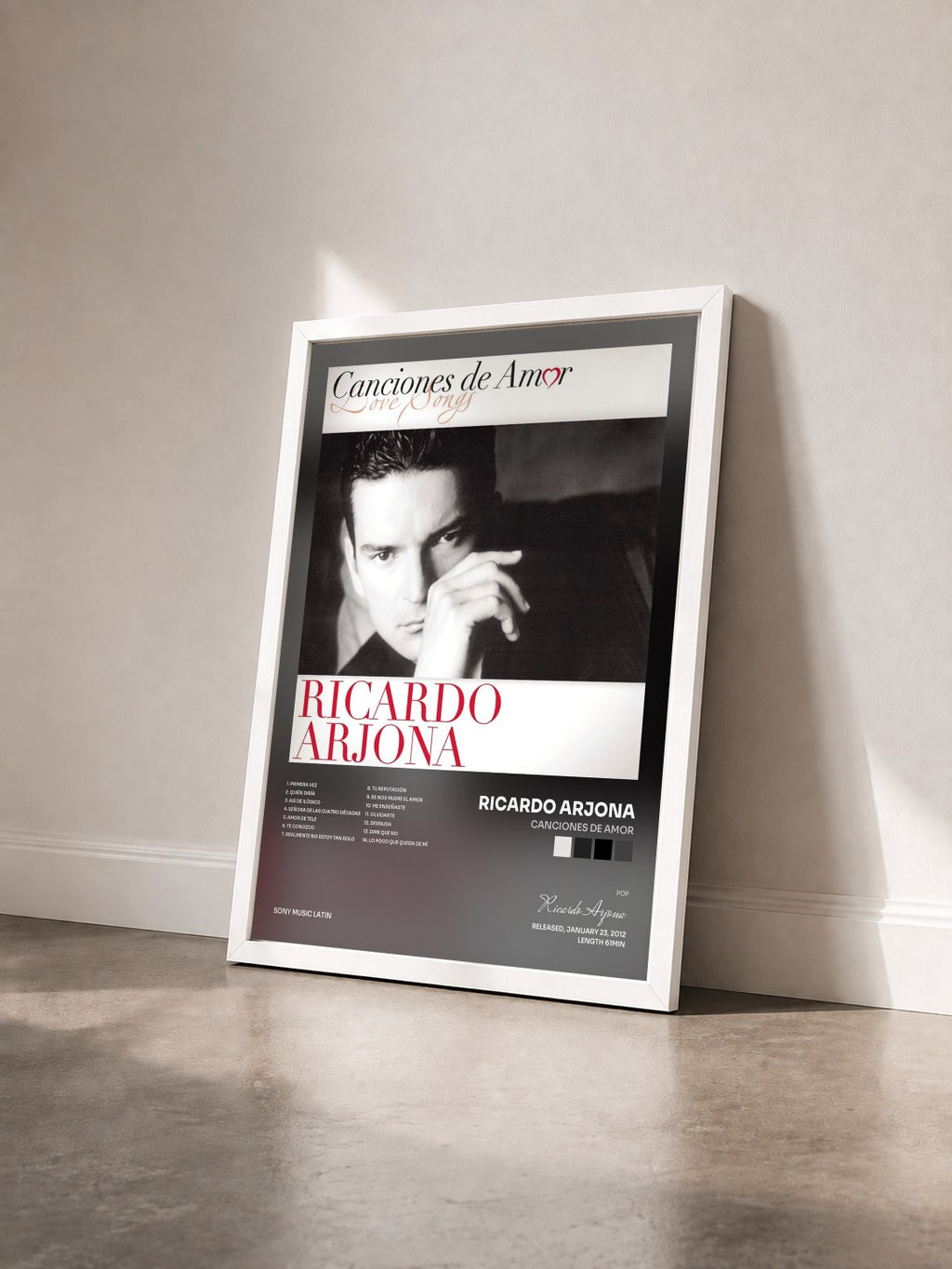 #blanc Tableau de l'album Canciones De Amor de Ricardo Arjona vu de trois quarts, cadre blanc