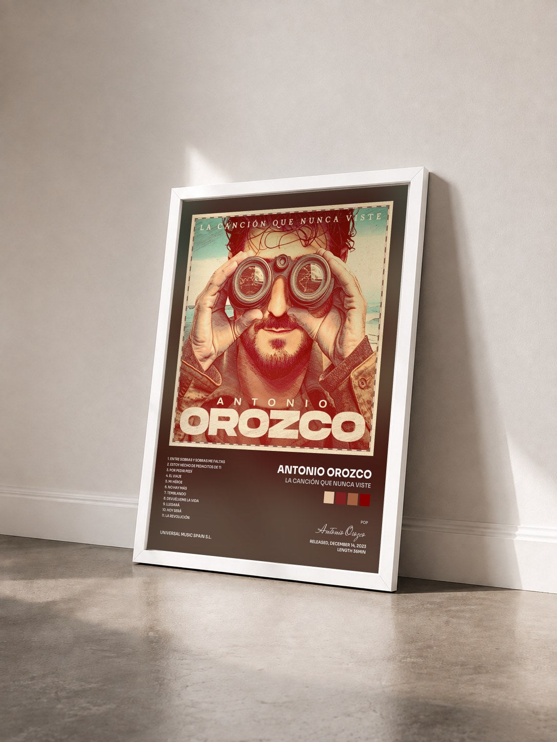 #blanc Tableau de l'album La Canción Que Nunca Viste de Antonio Orozco vu de trois quarts, cadre blanc