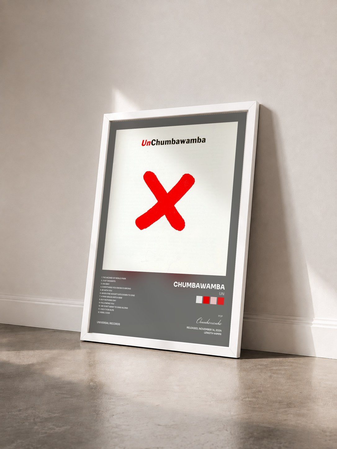 #blanc Tableau de l'album Un de Chumbawamba vu de trois quarts, cadre blanc