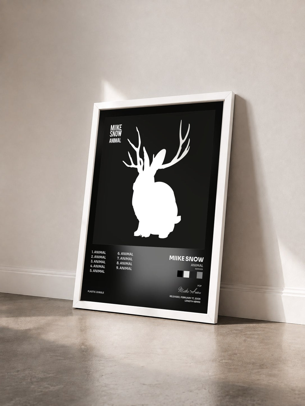 #blanc Tableau de l'album Animal (Remixes) de Miike Snow vu de trois quarts, cadre blanc