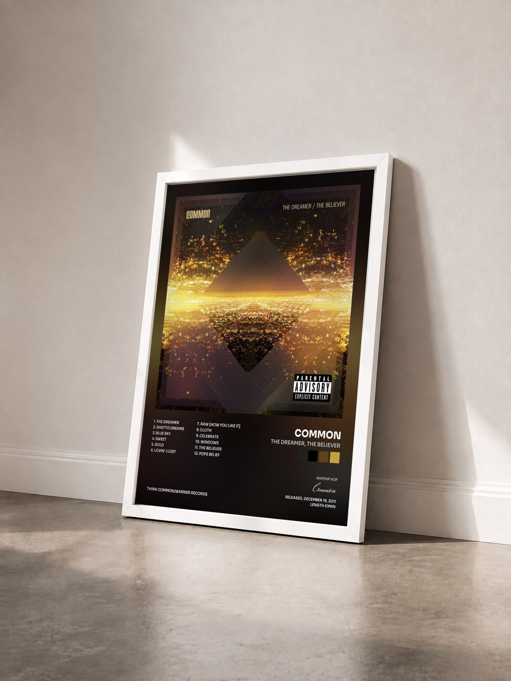 #blanc Tableau de l'album The Dreamer, The Believer de Common vu de trois quarts, cadre blanc