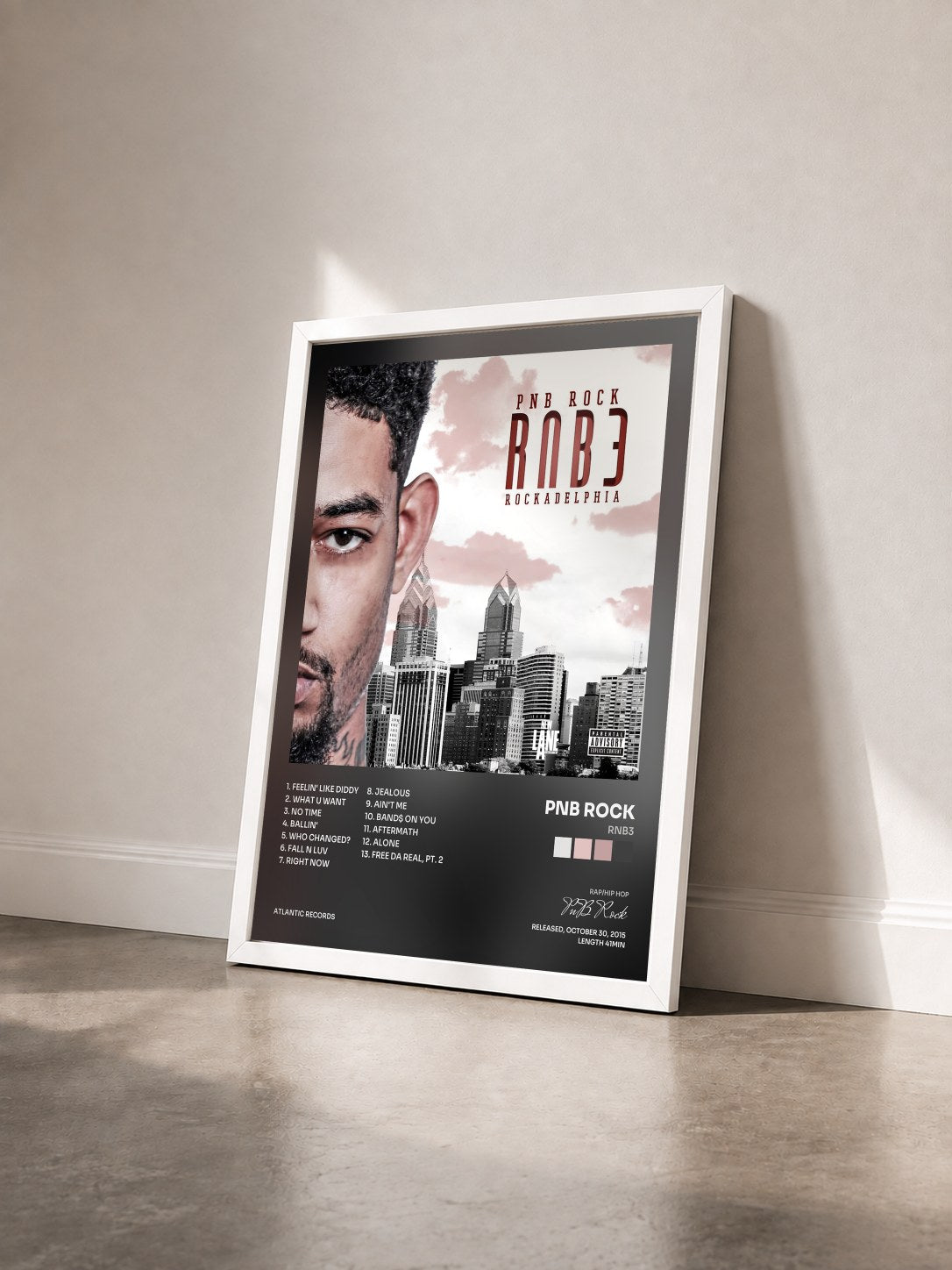 #blanc Tableau de l'album RNB3 de PnB Rock vu de trois quarts, cadre blanc