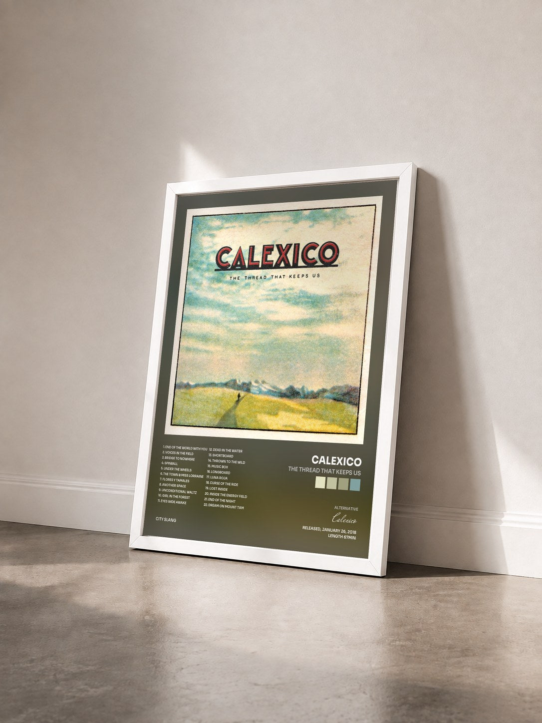 #blanc Tableau de l'album The Thread That Keeps Us de Calexico vu de trois quarts, cadre blanc