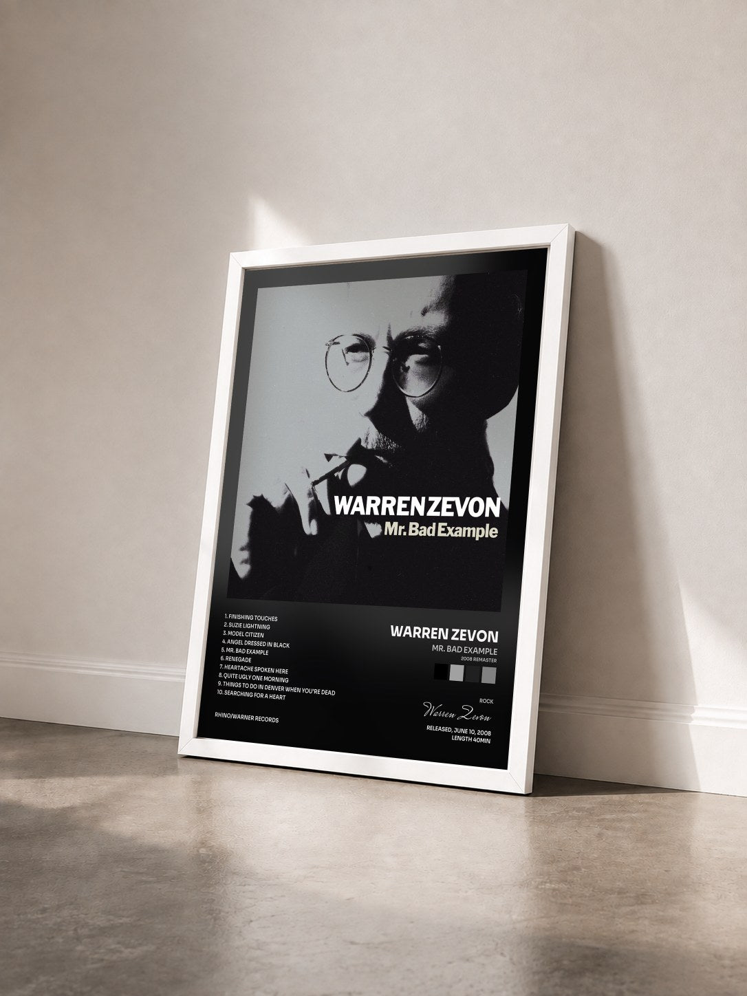 #blanc Tableau de l'album Mr. Bad Example (2008 Remaster) de Warren Zevon vu de trois quarts, cadre blanc