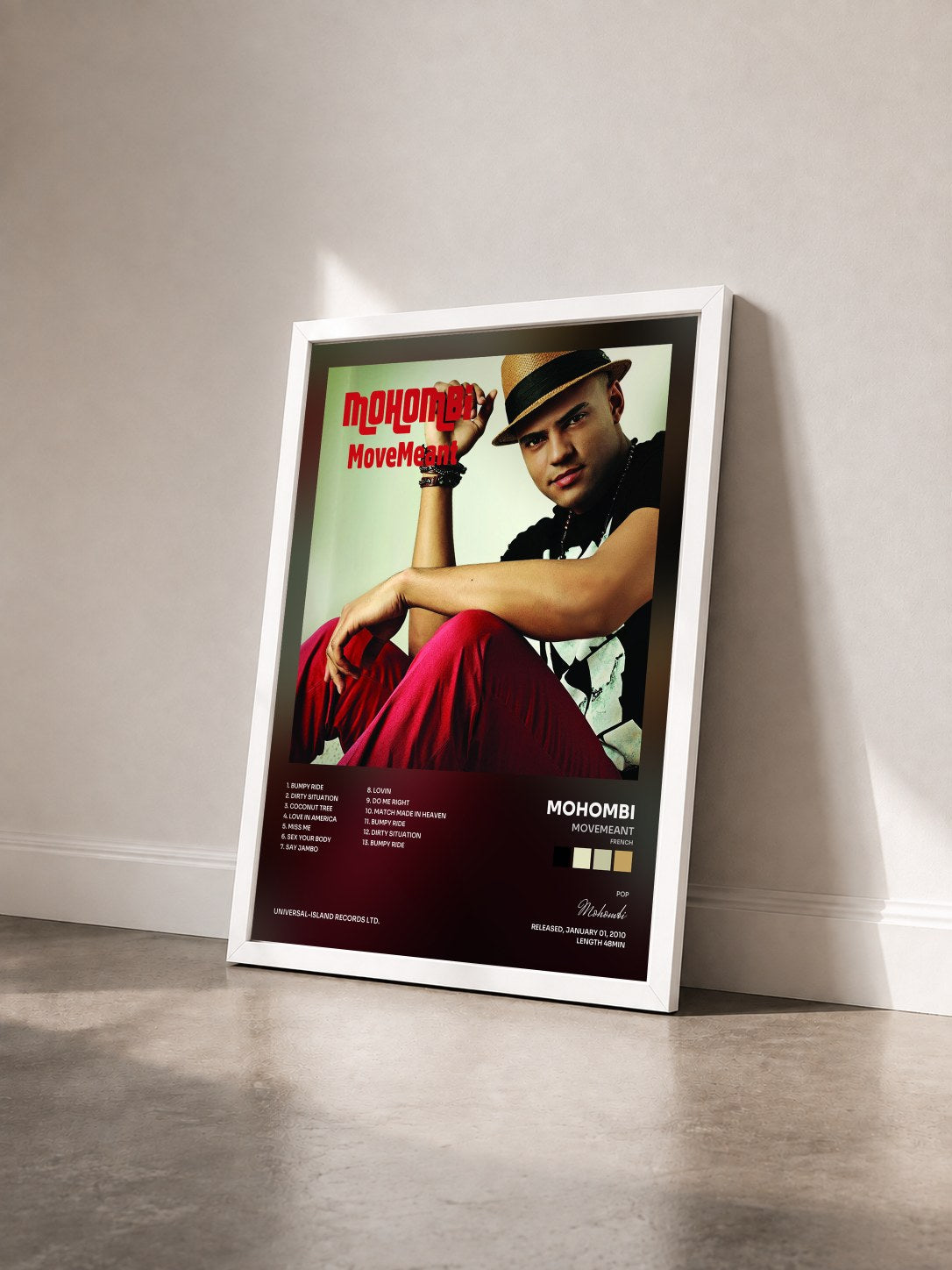 #blanc Tableau de l'album MoveMeant (French) de Mohombi vu de trois quarts, cadre blanc