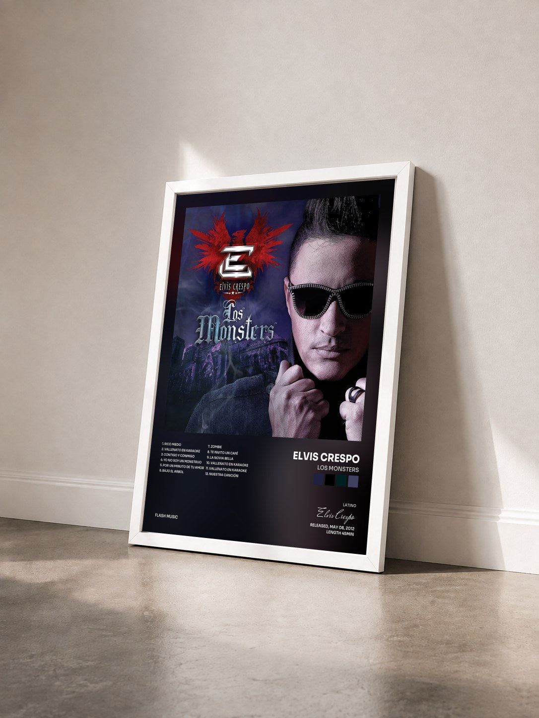 #blanc Tableau de l'album Los Monsters de Elvis Crespo vu de trois quarts, cadre blanc