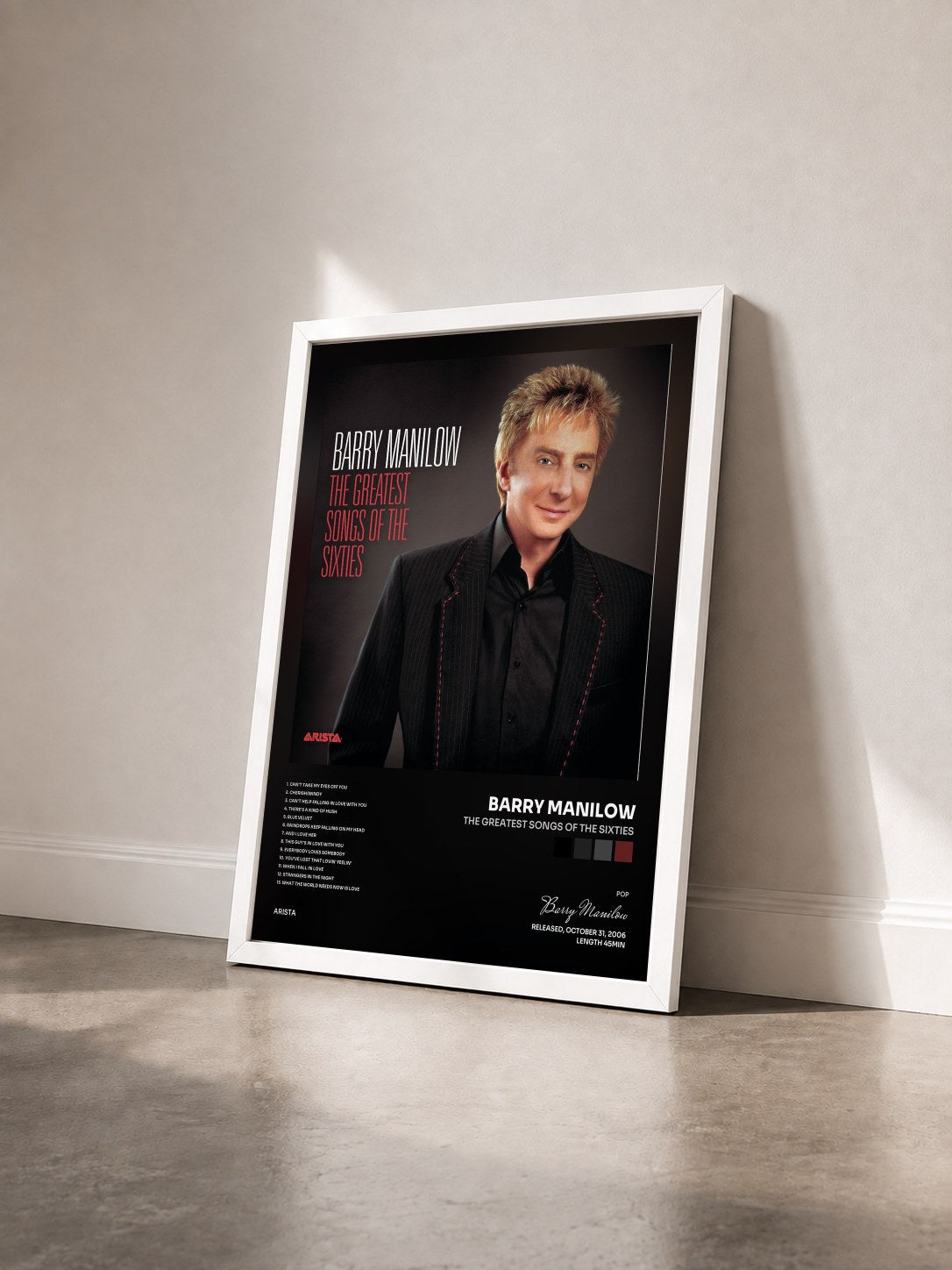 #blanc Tableau de l'album The Greatest Songs Of The Sixties de Barry Manilow vu de trois quarts, cadre blanc