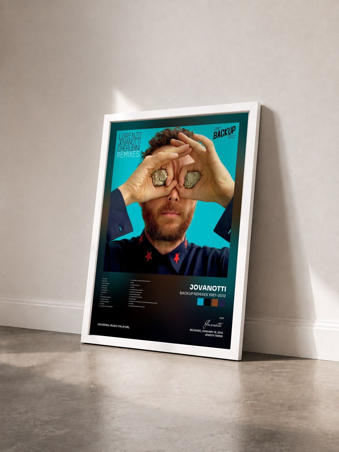 #blanc Tableau de l'album Backup Remixes 1987-2012 de Jovanotti vu de trois quarts, cadre blanc