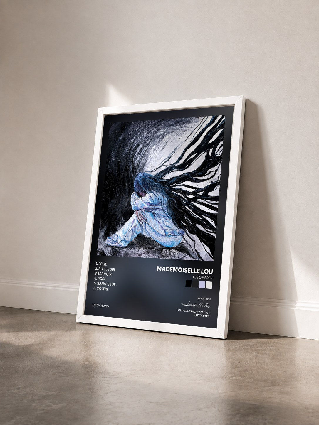 #blanc Tableau de l'album LES OMBRES de mademoiselle lou vu de trois quarts, cadre blanc