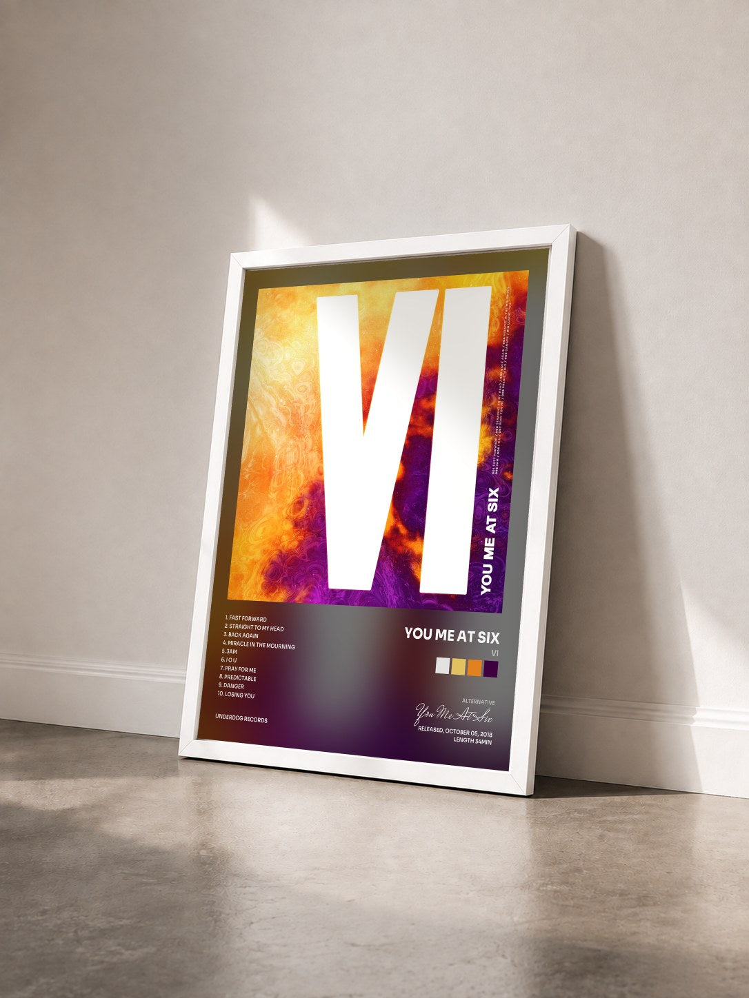 #blanc Tableau de l'album VI de You Me At Six vu de trois quarts, cadre blanc