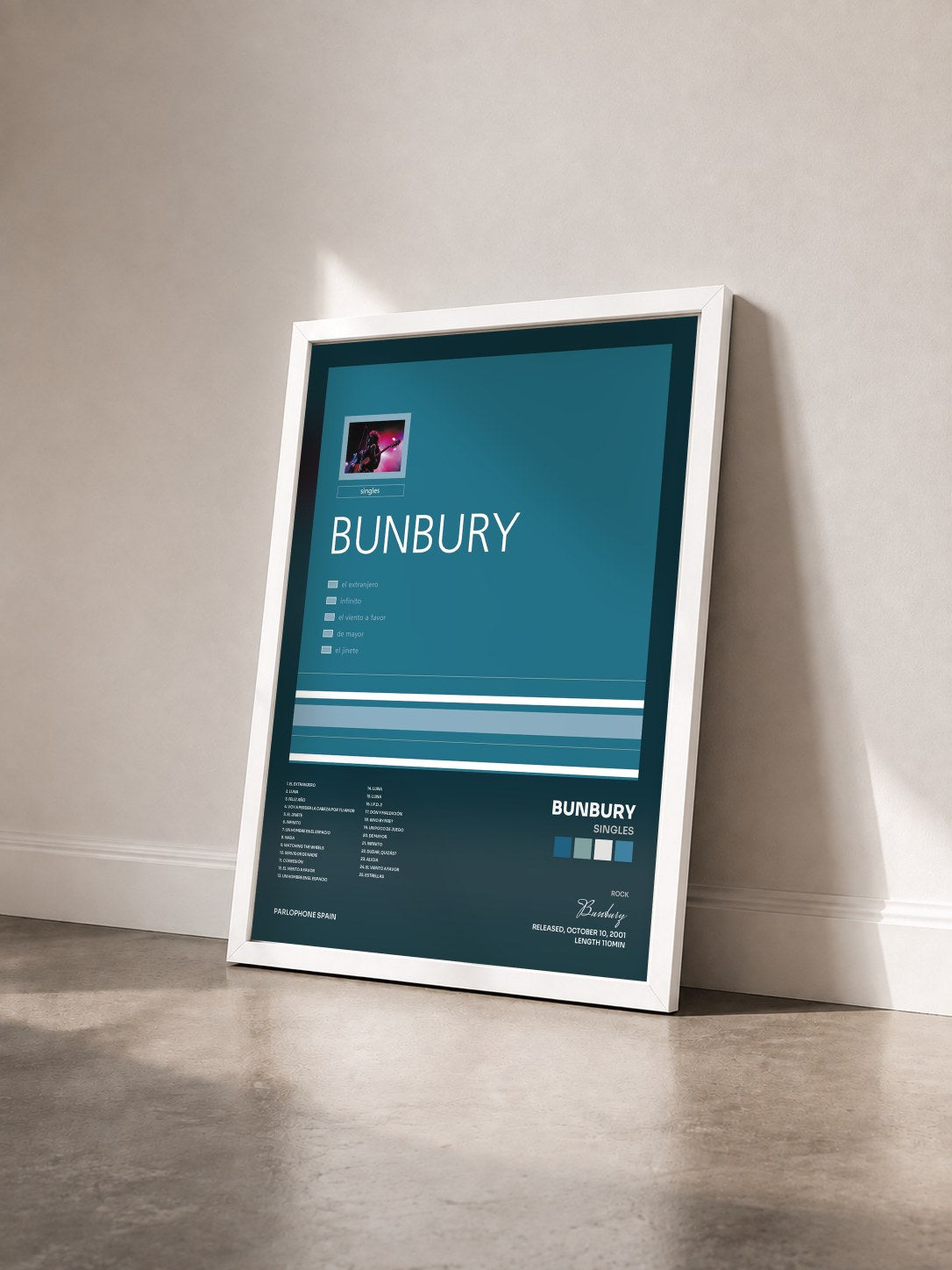 #blanc Tableau de l'album Singles de Bunbury vu de trois quarts, cadre blanc