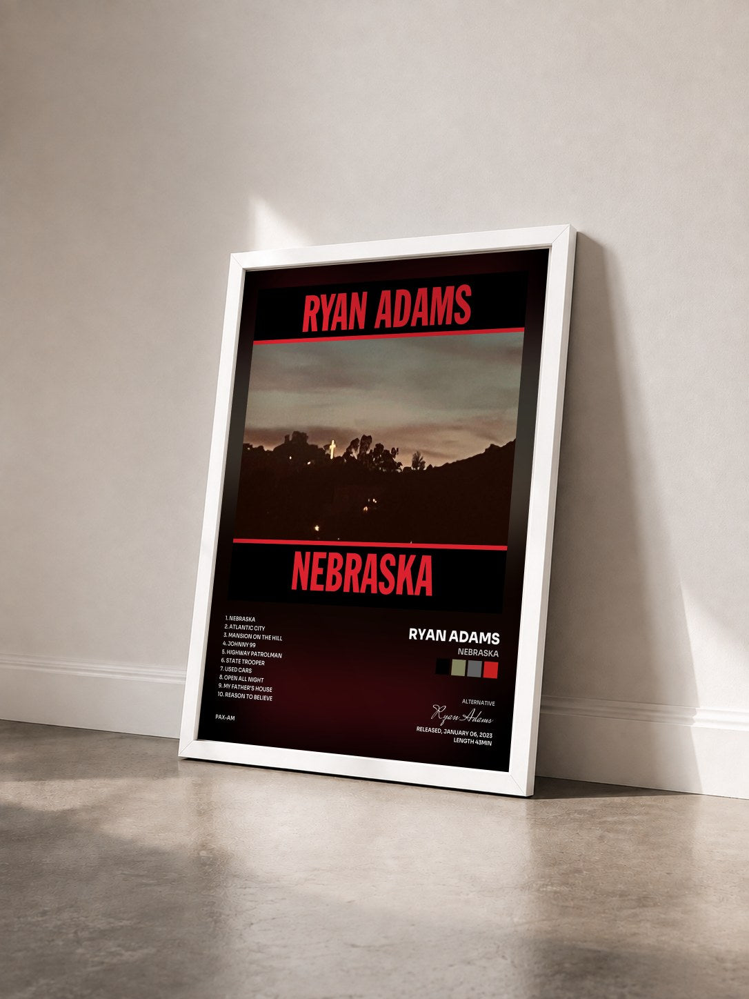 #blanc Tableau de l'album Nebraska de Ryan Adams vu de trois quarts, cadre blanc