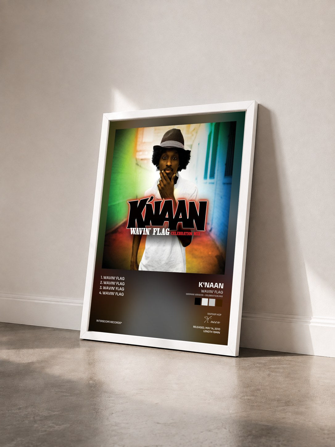 #blanc Tableau de l'album Wavin' Flag (German Version - Celebration Mix) de K'naan vu de trois quarts, cadre blanc