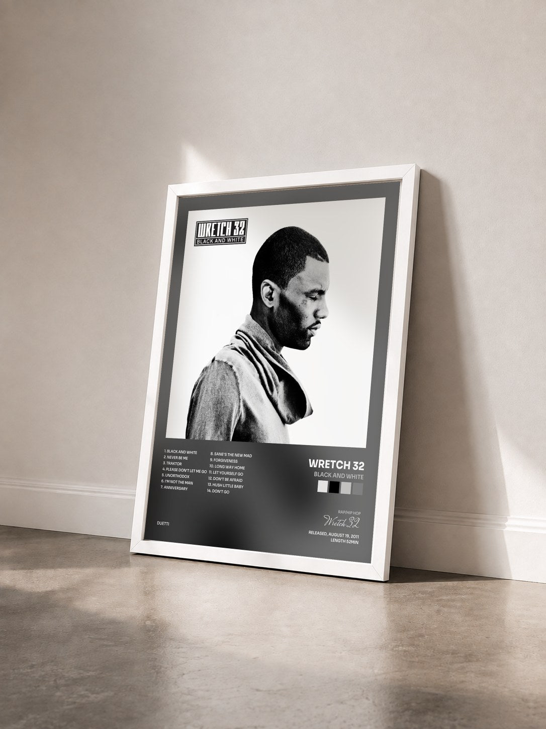 #blanc Tableau de l'album Black and White de Wretch 32 vu de trois quarts, cadre blanc