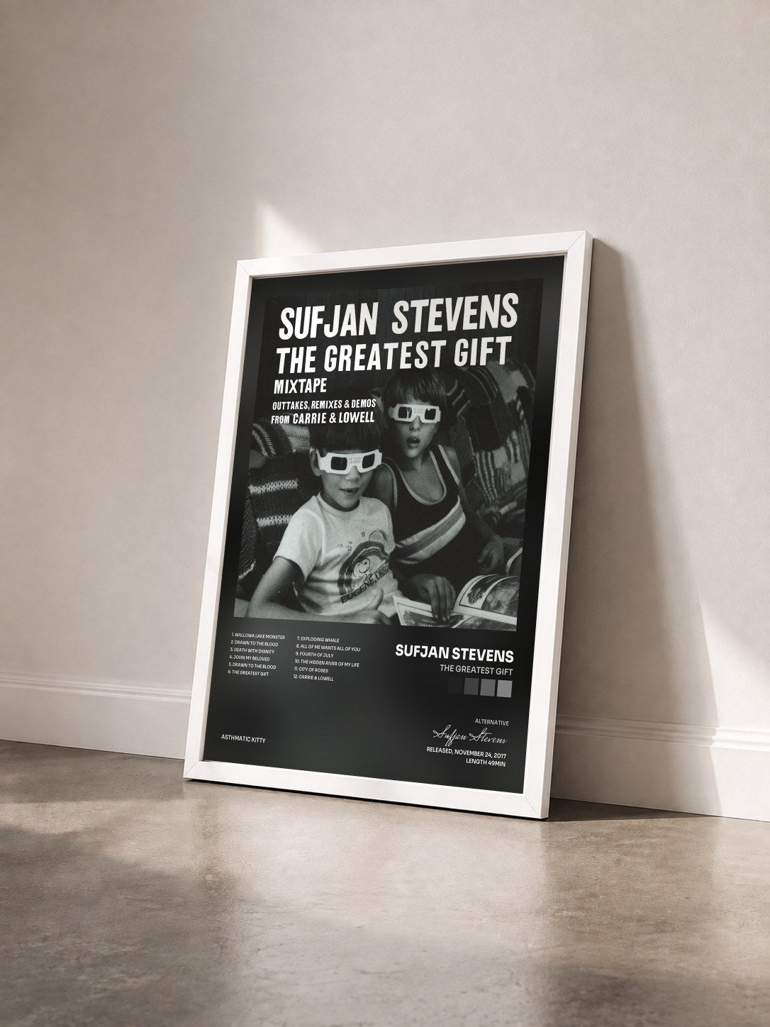 #blanc Tableau de l'album The Greatest Gift de Sufjan Stevens vu de trois quarts, cadre blanc