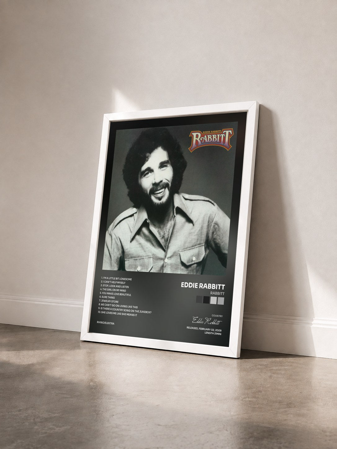 #blanc Tableau de l'album Rabbitt de Eddie Rabbitt vu de trois quarts, cadre blanc