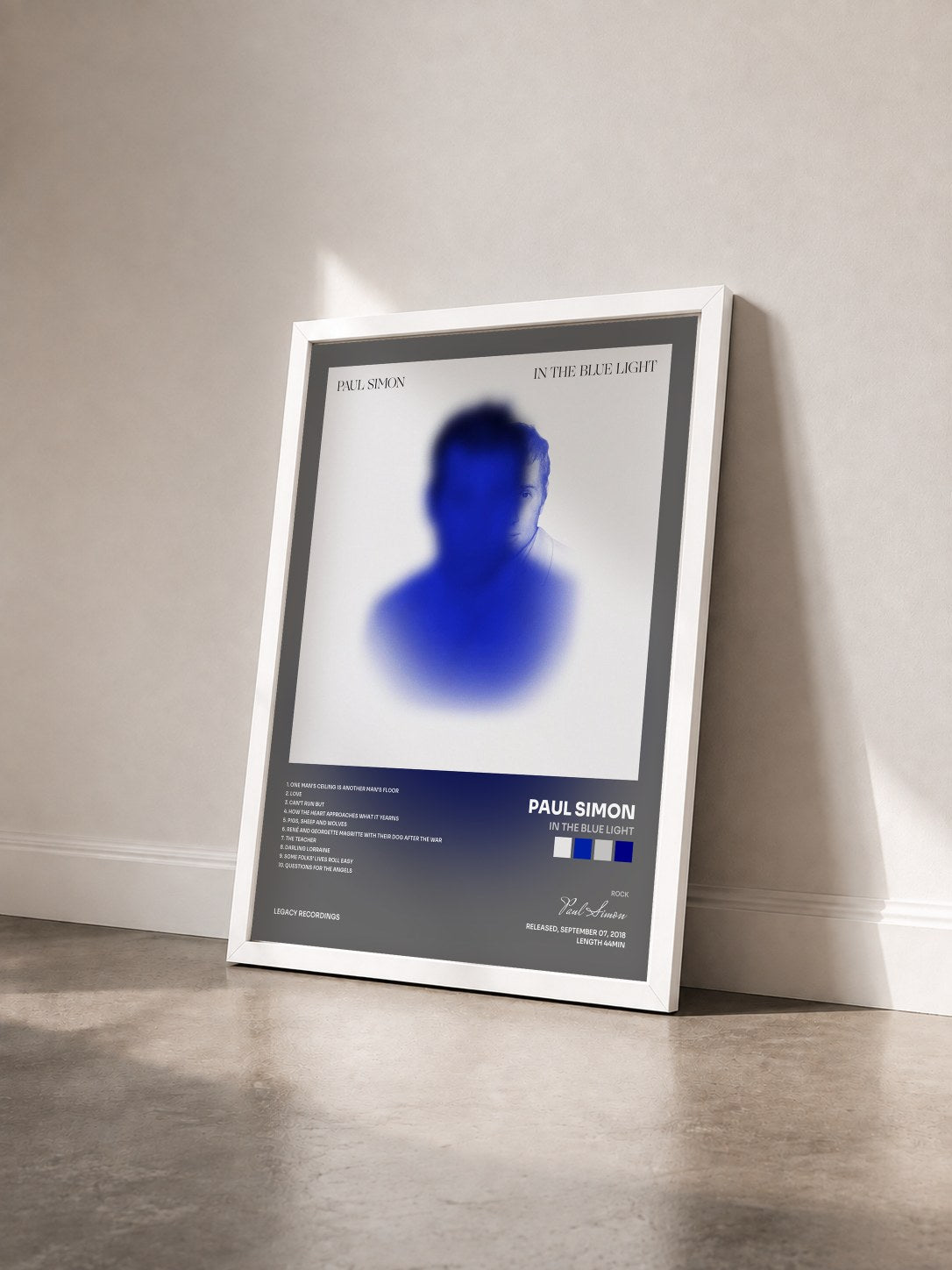 #blanc Tableau de l'album In the Blue Light de Paul Simon vu de trois quarts, cadre blanc