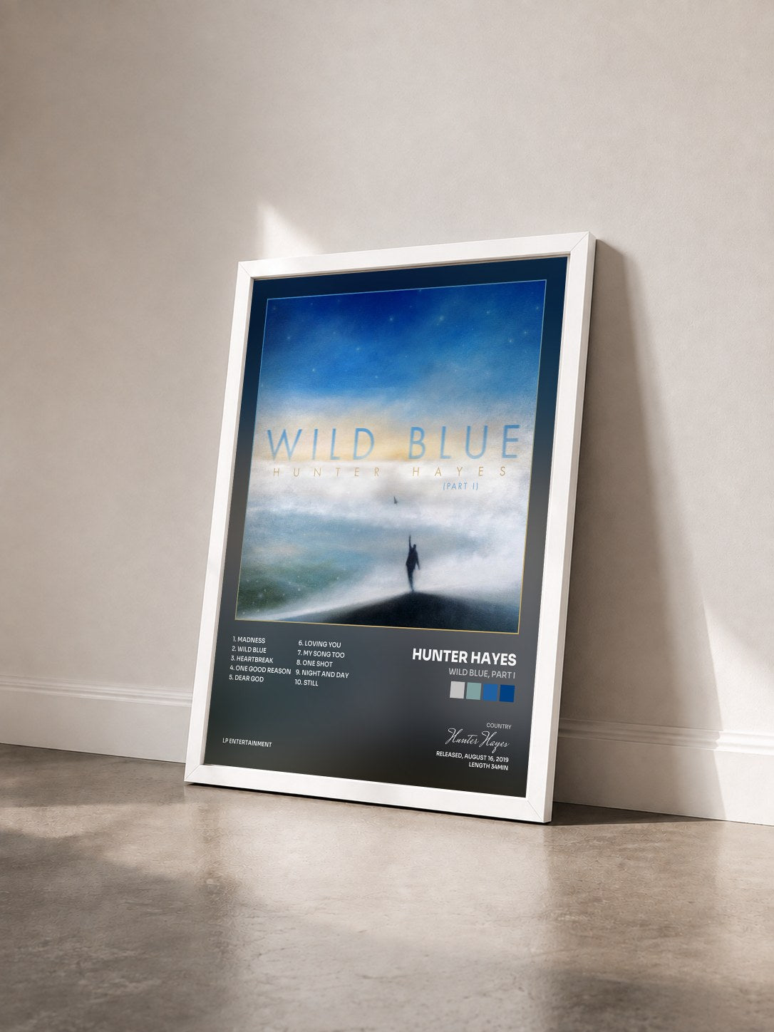 #blanc Tableau de l'album Wild Blue, Part I de Hunter Hayes vu de trois quarts, cadre blanc
