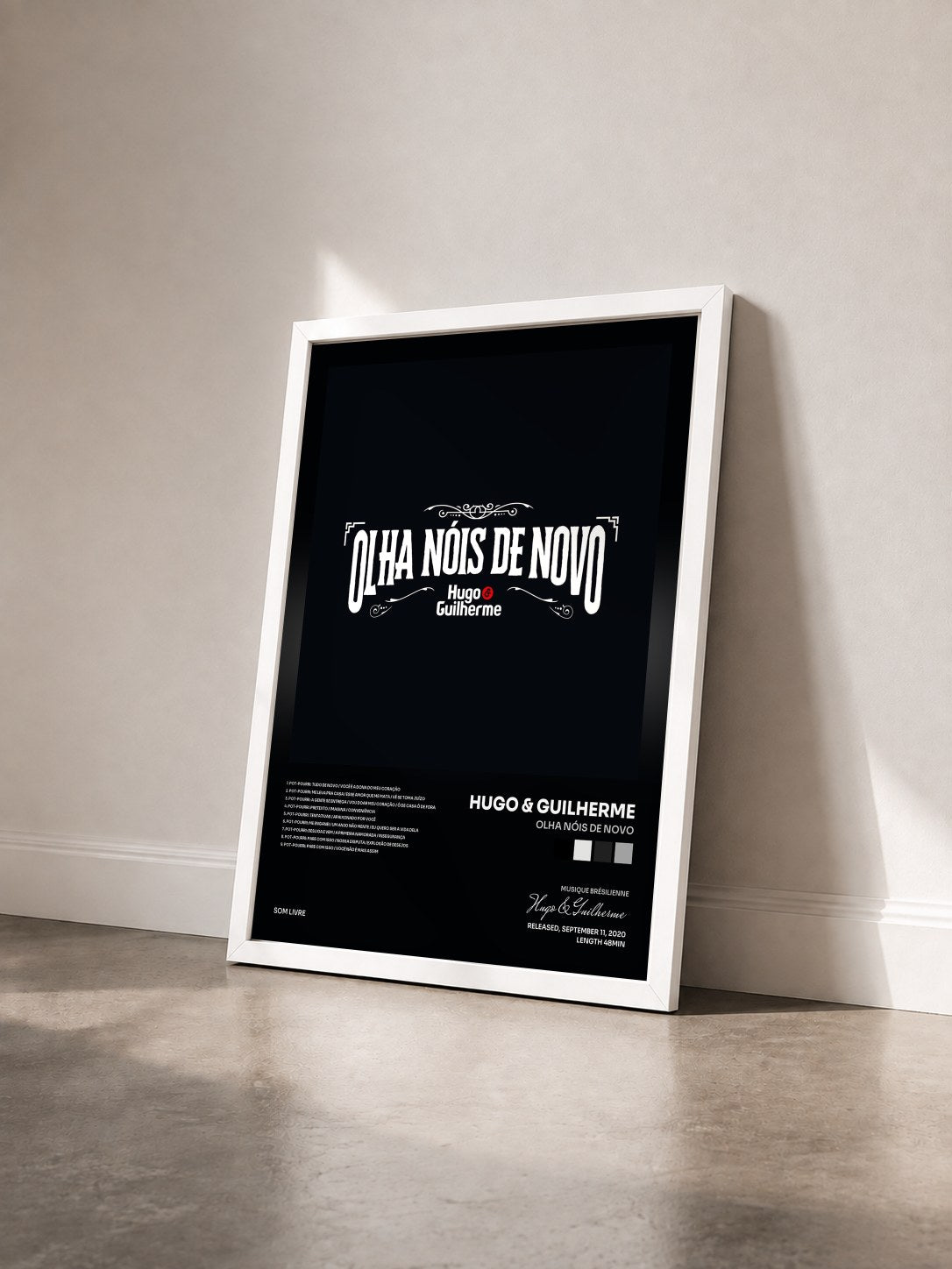 #blanc Tableau de l'album Olha Nóis de Novo de Hugo & Guilherme vu de trois quarts, cadre blanc