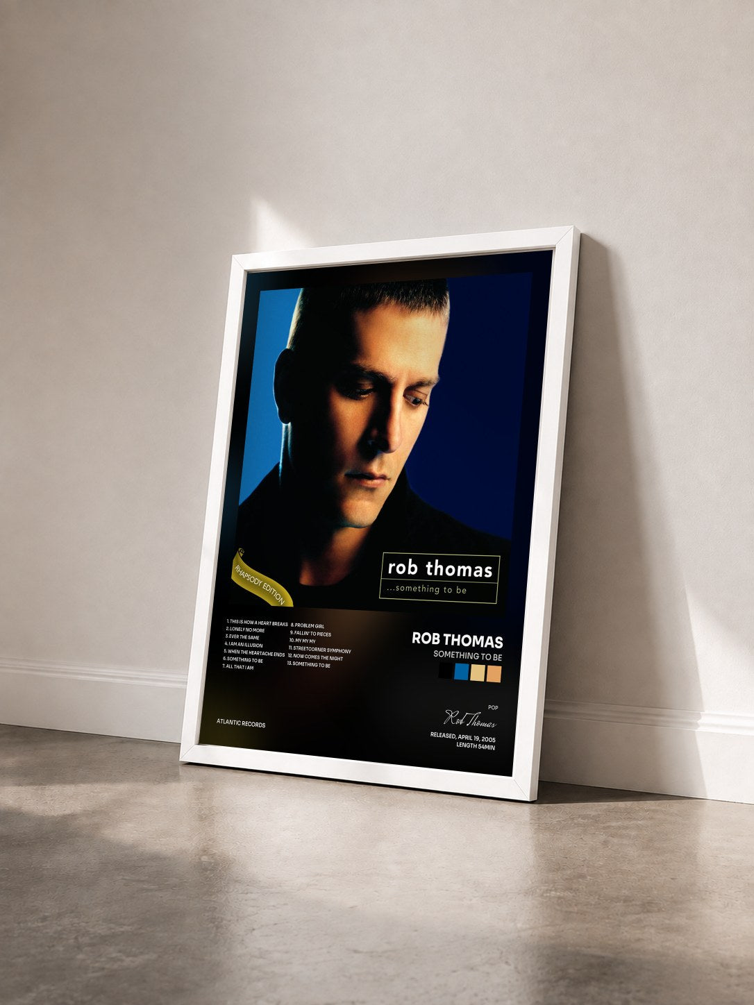 #blanc Tableau de l'album Something to Be de Rob Thomas vu de trois quarts, cadre blanc