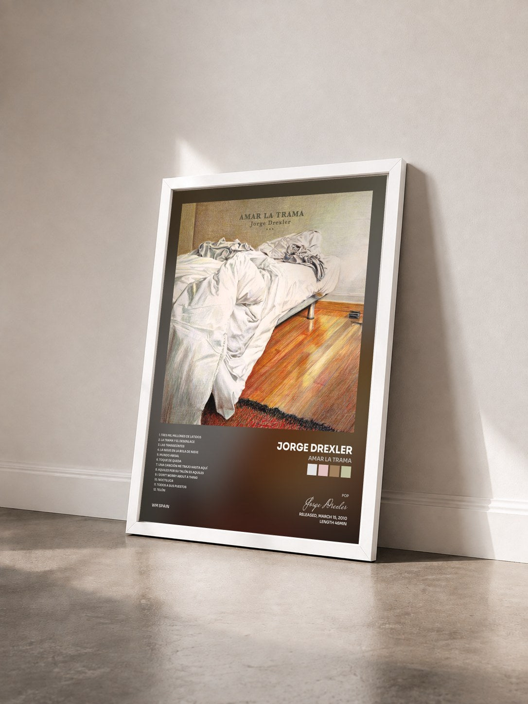 #blanc Tableau de l'album Amar la trama de Jorge Drexler vu de trois quarts, cadre blanc