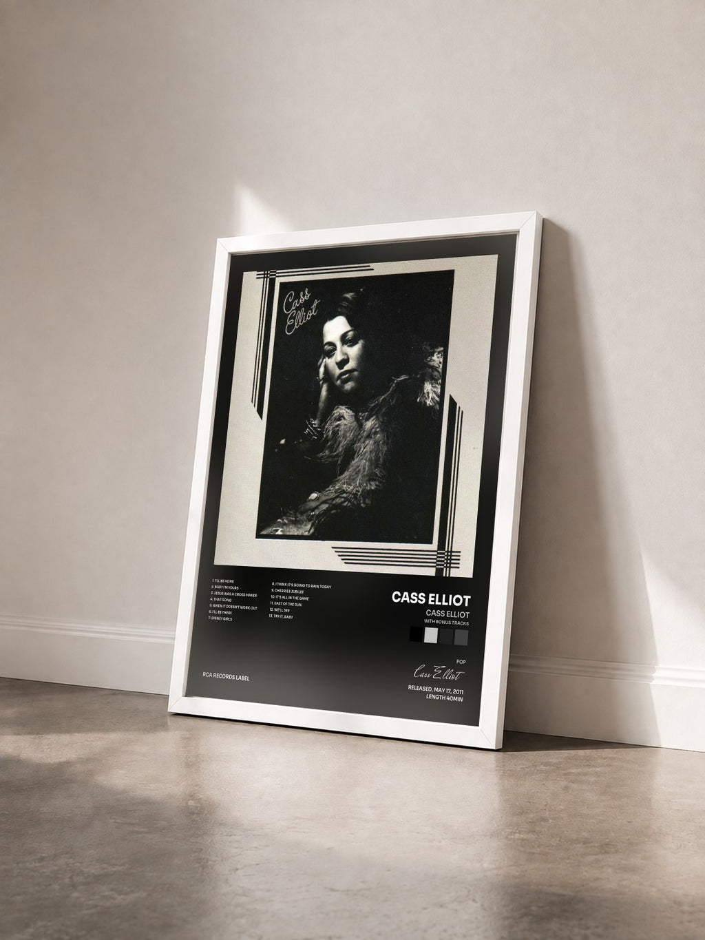 #blanc Cass Elliot (With Bonus Tracks) by Cass Elliot as a framed art print seen at an angle, white frame